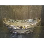 A Victorian boat shaped silver sweetmeat dish with half ribbed decoration and lion mask handles,