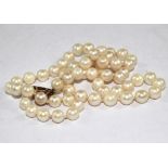 A string of cultured pearls on a 9 carat gold clasp