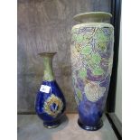 A Royal Doulton stoneware vase, of tapering form with piped rose decoration on a purple ground, J.H.