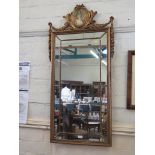 A French style giltwood wall mirror, with pictorial oval and floral swags over a segmented