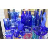 Various blue glass bottles, vases and dishes