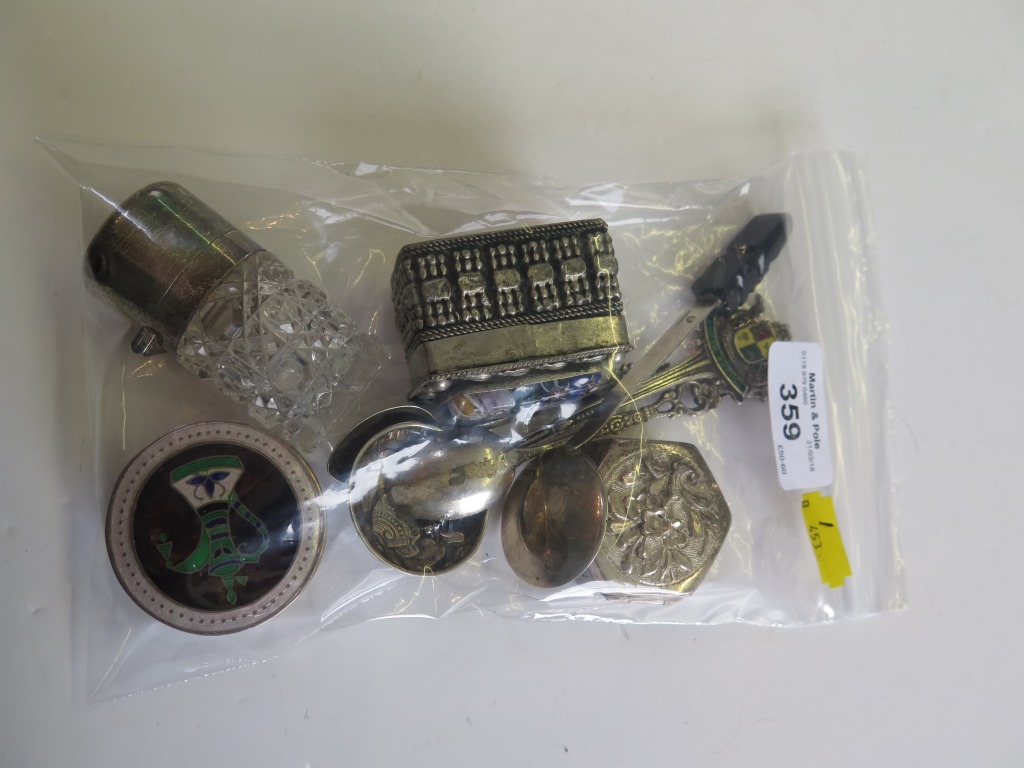 A collection of silver items to include boxes, silver topped scent bottle, spoons, etc