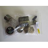 A collection of silver items to include boxes, silver topped scent bottle, spoons, etc