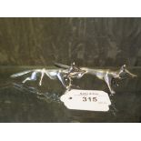 A pair of silver plated knife rests in the form of foxes