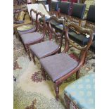 A set of four early Victorian rosewood balloon back dining chairs, with lobed baluster legs (4)