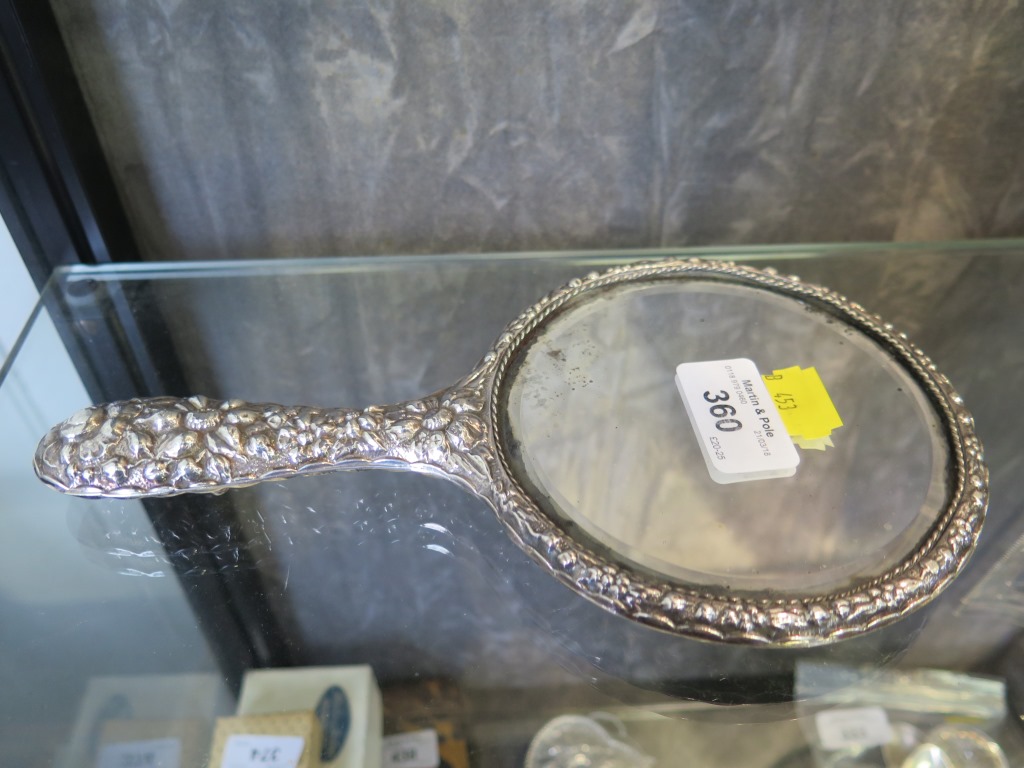 A ladies silver hand mirror