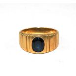 A 14 carat gold ring set with a sapphire