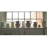 A Denby Pottery blue glaze candlestick, a Cadburys stoneware jug and other stoneware and ceramic