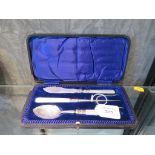 A cased jam spoon, butter knife and bread fork, all with mother of pearl handles