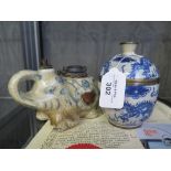 A Chinese blue and white ceramic pipe in the form of an elephant 14cm long with certificate from