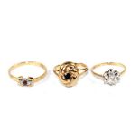 A set of three gem set rings, diamond ruby and sapphire