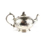 A good quality silver plated tea pot with floral engraved design and floral finial