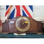 A 1920s oak mantel clock, with silvered dial, the three train movement striking on a gong, 52cm