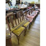 A set of six early Victorian mahogany balloon back chairs, with scroll carved midrails, drop in