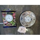 A silver circular shaped bedside clock, London 1994, together with a Masons miniature porcelain