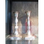 A pair of Sheffield plate telescopic candle sticks