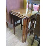 A nest of three Edwardian tables of plain rectangular form with boxwood stringing on tapering