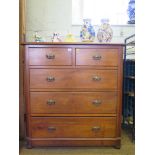 An Edwardian stained beech chest of drawers, with two short and three long graduated drawers on