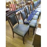 A set of four Victorian mahogany dining chairs, the square backs with upholstered panels,