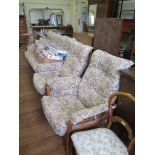 An oak Ercol Saville three piece suite, comprising three seat settee and two armchairs