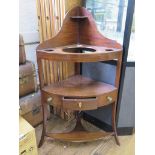 A George III mahogany and ebony lined corner washstand with raised back, single drawer and