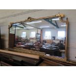 A large Italian giltwood framed mirror with cabochon and acanthus scroll carving 236cm wide 103cm