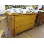 A 1980s satin birch chest of three long drawers, with rounded protruding top 120cm wide