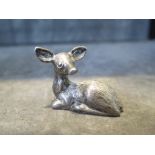 A cast silver fawn