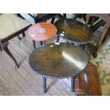 Two oval topped occasional tables with bobbin turned legs, a red lacquered tripod table, and a