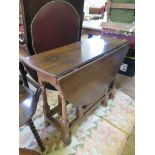 A George III style oak gateleg table, the oval top above a frieze drawer on baluster turned legs