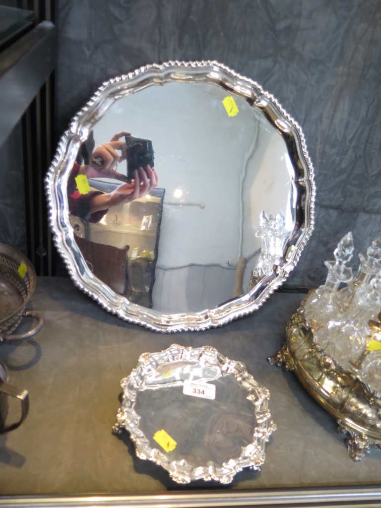 A silver plated round tray with gadrooned edge together with a small silver plated waiter