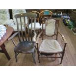 An ash kitchen armchair, with high rail back over a moulded seat and turned legs, and an Edwardian