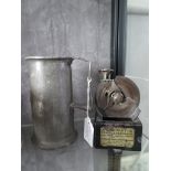 An automatic pencil sharpener, 12cm high and a French pewter half litre measure, 14cm high