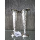 A pair of silver specimen vases decorated in the Art Nouveau style