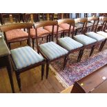A set of five Regency rosewood dining chairs, the broad top rails over brass inlaid mid rails