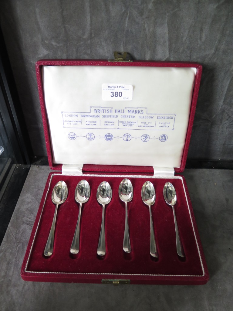 A cased set of silver coffee spoons showing six different hallmarks