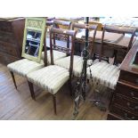 A set of five Italian stained beech dining chairs, with cross frame mid rails, stuffover seats,