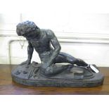 A late Victorian verde antico marble sculpture of a slain naked warrior seated with a rope around