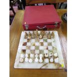 A marble chess set and board, cased, board 40.5cm square