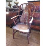 A 19th century ash and elm Windsor armchair, the spindle back with wheel turned vase shape splat and