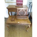 An Indian camphorwood foldover tea table, with serpentine top on floral carved cabriole legs, 83cm