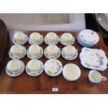 A Tuscan China part tea service with flower and butterfly pattern and blue edge (38 pieces)