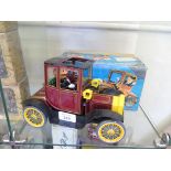 A Japanese Nomura tinplate 'Grandpa's Classic Car' toy, battery operated with shaking action and