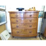 A Victorian mahogany bowfront chest of drawers, with two short and three long graduated drawers on