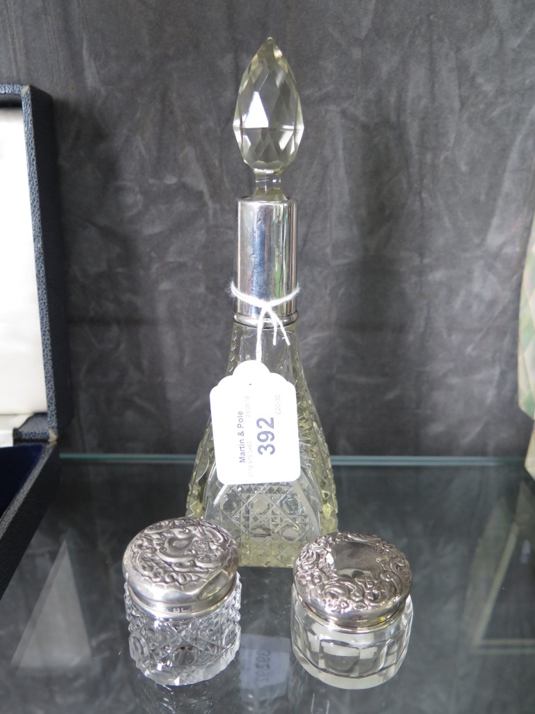 Cut glass silver hallmarked collared scent bottle together with two silver top rouge pots with cut