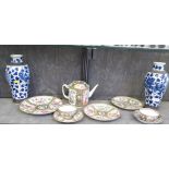 A Chinese Famille Rose teapot, two cups and saucers and three plates, also a pair of blue and