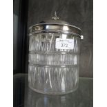 A cut glass bon bon / biscuit barrel with silver plated top