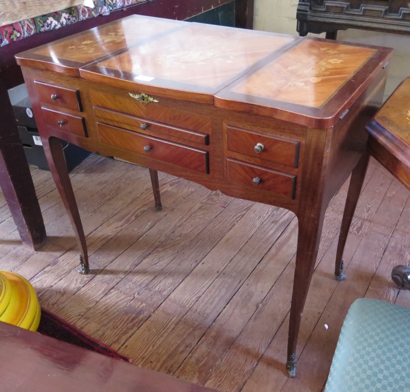 A 19th century continental inlaid Kingwood Poudrouse or dressing table, the hinged top enclosing a
