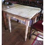 A painted pine kitchen table, with frieze drawer on turned tapering legs 82cm x 73cm x 78cm wide