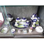 A Noritake dressing table set, with blue ground depicting landscapes (as found), Limoges pill boxes,